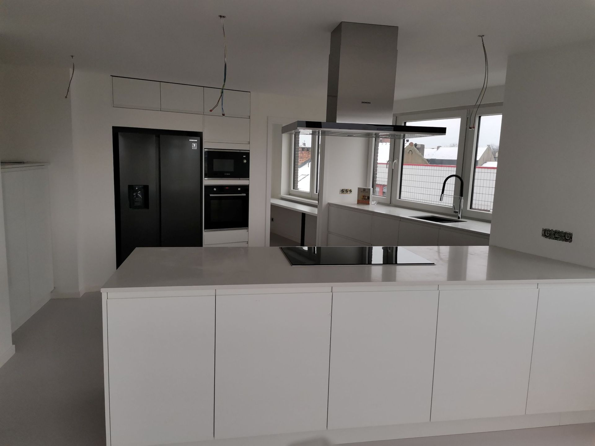 Schilderwerken in Vilvoorde – geschilderde keuken en woonruimte in woning